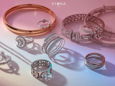 “Attractive trending stainless steel jewelry collection with rings, bracelets, and necklaces arranged beautifully on a neutral background, vibrant lighting, watermark ‘viona pk’, image size 178×100 pixel (1)
