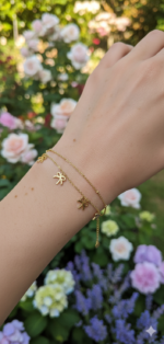 Gold bow charm bracelet - Image 2