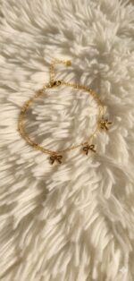 Gold bow charm bracelet - Image 3