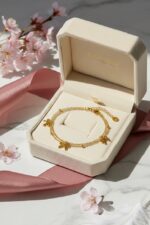 Gold bow charm bracelet